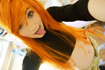 Kim Possible cosplay girl sticking out her tongue playfully