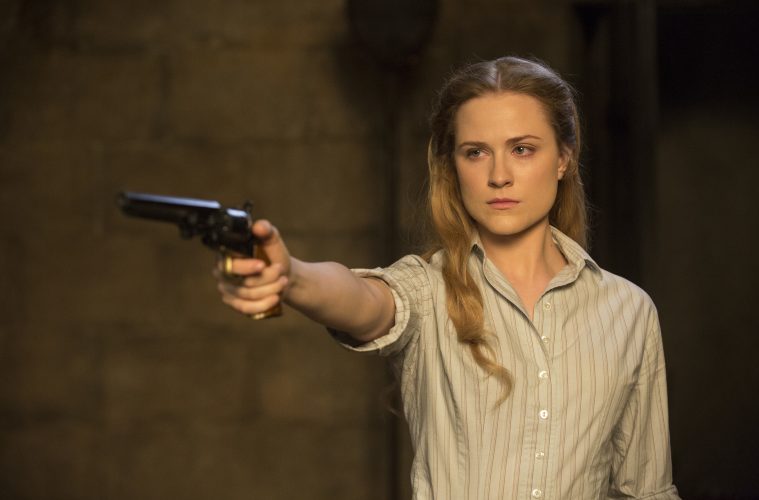 Delores holds a pistol in westworld