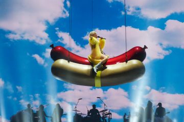 Miley Cyrus on a giant hot dog