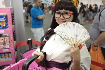 harriet in a kimono with a fan at japanese convention