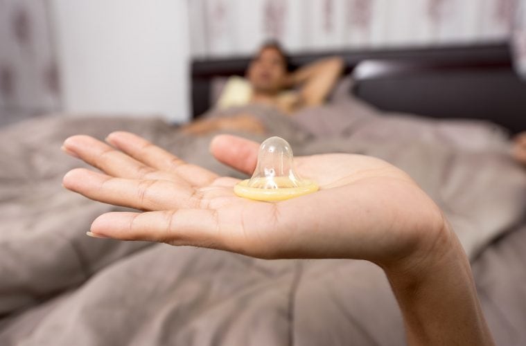 condom in hand stock image free use